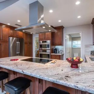 a kitchen with granite countertops