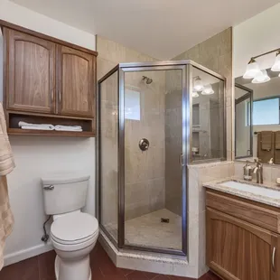 a bathroom with a shower and sink