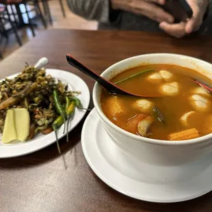 Laphet Toh (Tea Leaf Salad) on the left and Tom Yum seafood soup on the right.