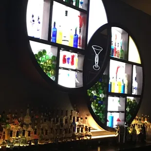 two circular mirrors on the wall