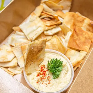 a box of pita chips and dip