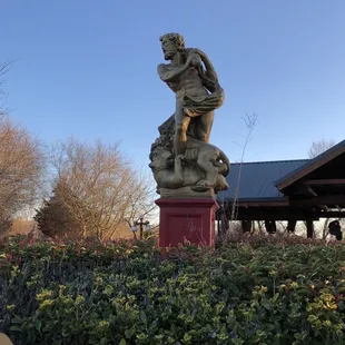 a statue in a garden