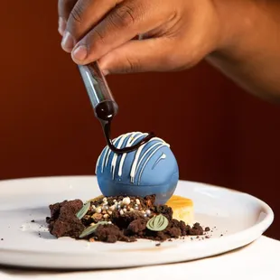 The Chocolate Globe, a signature dessert inspired by the Planet Word museum's Globe in the Great Hall.