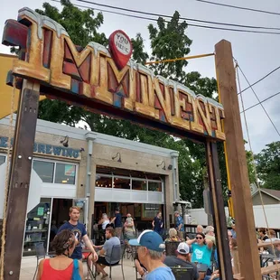 people sitting at tables outside