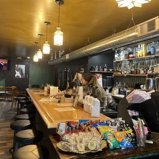 a woman sitting at a bar
