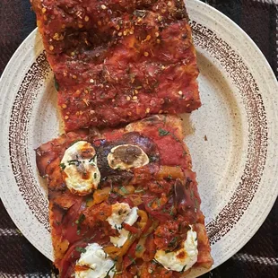 1 Marinara slice and 1 Diavola slice.  Both the right amount of spicy!  Chewy, crispy dough. Highly recommend!