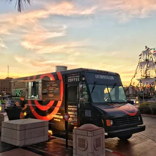a food truck parked in a plaza