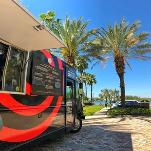 a black and red food truck