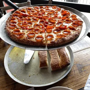 a pizza and bread on a table