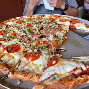 Deluxe: Homemade Ground Italian Sausage, pepperoni, mushrooms, onions, and green peppers.