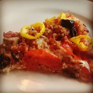 10 inch meat pizza with banana peppers and black olives added to half. Great for two or three people.