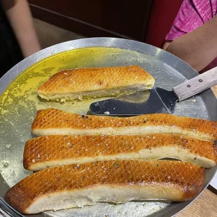 Bread sticks soaked in garlic butter. Sorry we ate some before taking the pictures