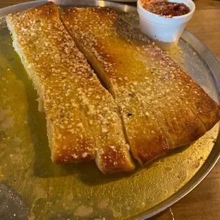 Breadsticks come soaked in oil