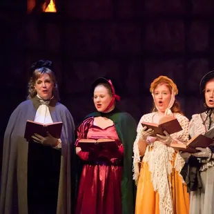 a group of people dressed in period costumes