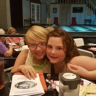 two women sitting at a table