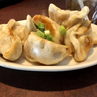 Homemade delectable Potstickers. Look at that sear and that puff.