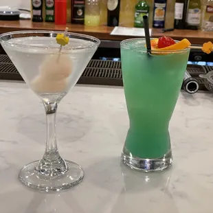 two cocktails on a bar