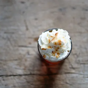 a cup of coffee with whipped cream