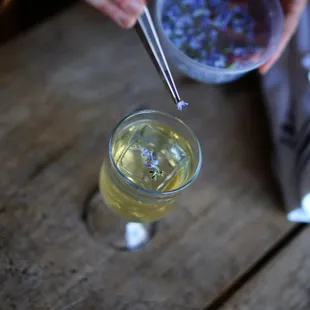 a person pouring a drink