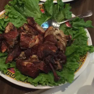 a plate of meat and lettuce