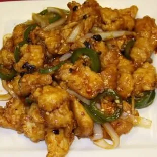 a plate of stir fried chicken