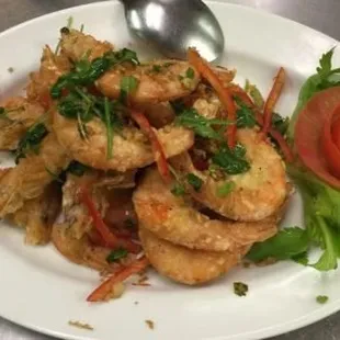 a plate of fried shrimp and vegetables