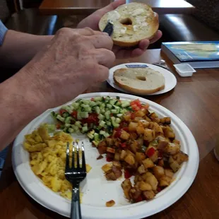 Imperial Breakfast.  Eggs, potatoes,  Israeli salad, and bagel.