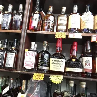 a shelf of liquor bottles
