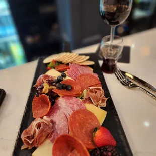 a platter of meat and cheese
