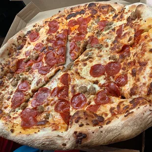 a large pepperoni pizza in a box