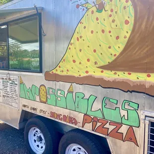 a food truck with graffiti on the side