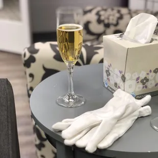 sparkling cider in a real glass champagne flute and the white gloves they have you wear to look at dresses.