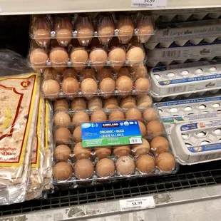 a display of eggs in plastic containers