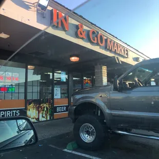 a truck parked in front of a store