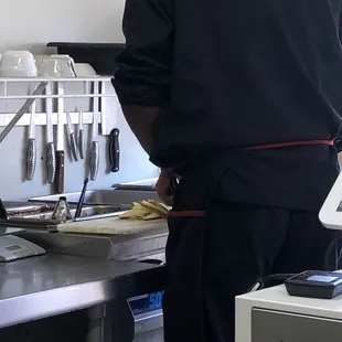 a man standing in a kitchen