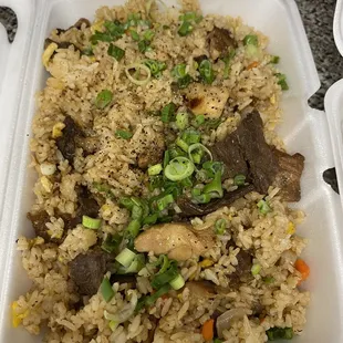 Special fried rice. Chicken shrimp pork beef and scallions carrots peas, all good but rice is a little dry, needs pineapple.