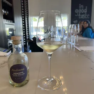 a glass of wine and a bottle of wine