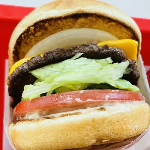 ows two hamburgers on a red tray