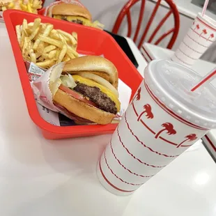 ows two baskets of fries and a drink