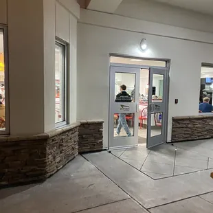 ows a man entering a restaurant