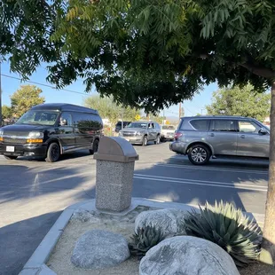ows a parking lot with cars and trucks