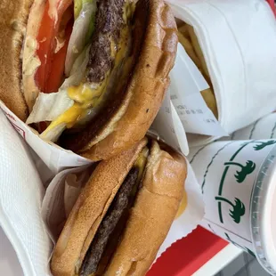 Cheeseburger with whole grilled onion, cheeseburger plain, light well fries no salt, and vanilla shake