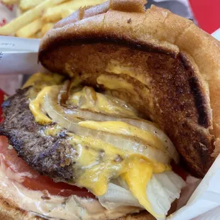 Cheeseburger with whole grilled onion, light well fries no salt.