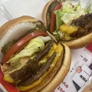 Double double animal style with raw onions, cheeseburger animal style with xtra lettuce