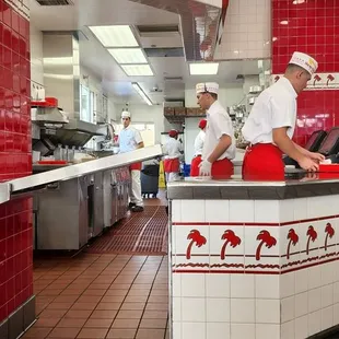 Hard at work making delicious So Cal Fresh to order burgers and fries.