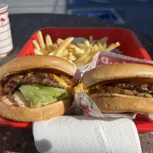 ows two hamburgers and french fries