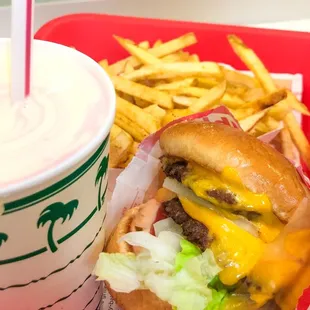 Double burger with fries and a shake