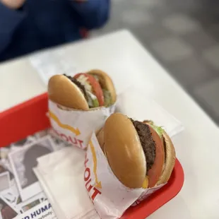 ows two hamburgers on a tray