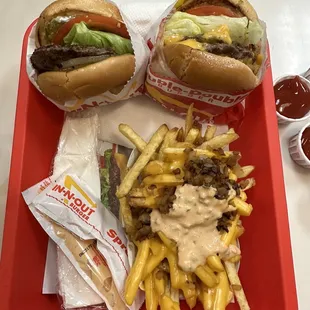Animal style hamburger and double double with grilled whole onions and chopped peppers, animal fries light well