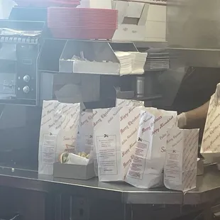 Lining up the take out orders.